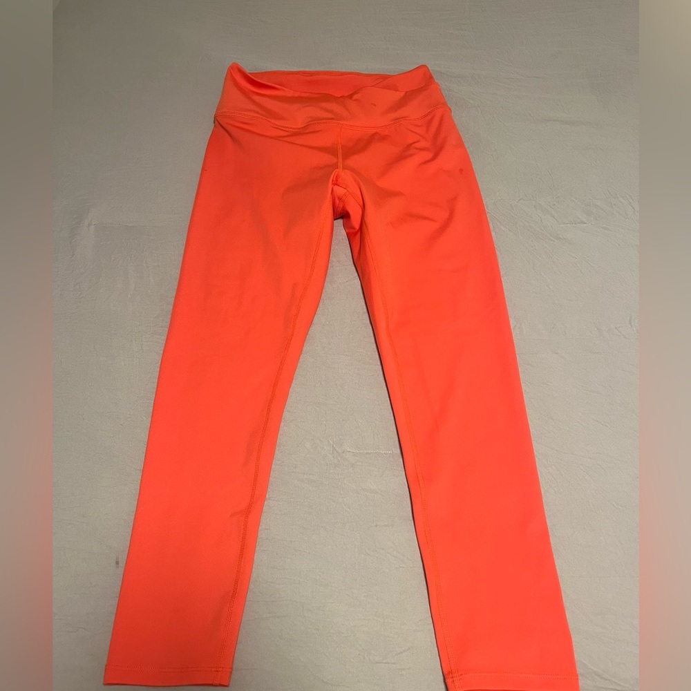 Free People Movement Leggings. New, never worn. Size M. Orange.